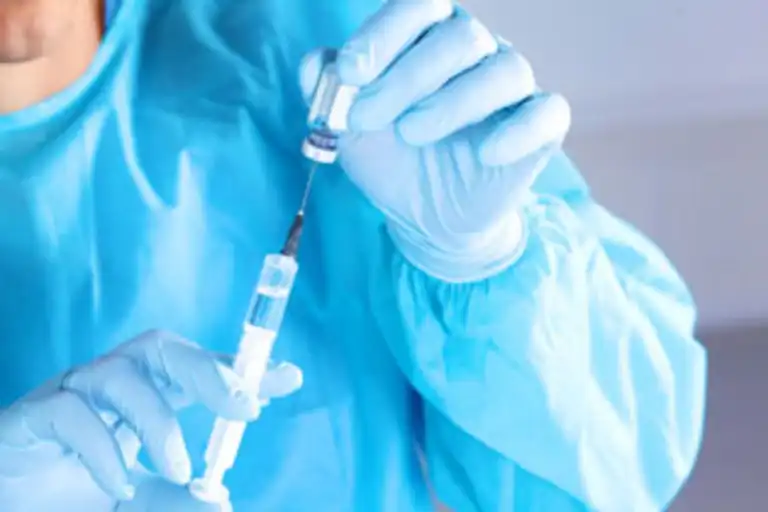 syringe in the hands of the doctor, close-up